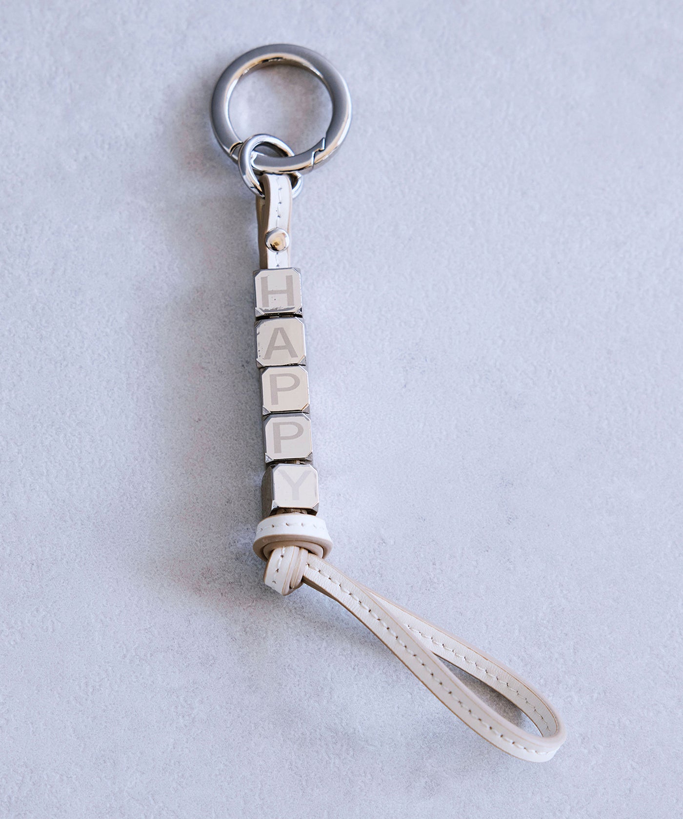 店舗・公式EC限定／HAPPY ロゴチャーム – TOPKAPI（トプカピ）